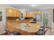 Eat in kitchen features granite countertops, wooden cabinets, stainless steel appliances and tile backsplash at 27891 Columbine Rd, Evergreen, CO 80439