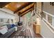 Open concept living room featuring wood ceilings, stairs, and ample natural light at 27891 Columbine Rd, Evergreen, CO 80439