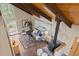 High-angle view of the living room with a vaulted ceiling and cozy furnishings at 27891 Columbine Rd, Evergreen, CO 80439