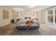Comfortable main bedroom with soft carpet, neutral walls, and a sliding glass door leading to a patio at 27891 Columbine Rd, Evergreen, CO 80439