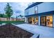 Backyard featuring a patio, garden bed, and large glass doors leading inside at 3087 S Dexter Way, Denver, CO 80222