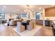 Spacious open-concept living room and dining area featuring modern decor, hardwood floors, and ample natural light at 3087 S Dexter Way, Denver, CO 80222