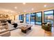 Bright living room boasts hardwood floors and sliding glass doors leading to the backyard patio at 3087 S Dexter Way, Denver, CO 80222