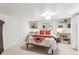 Basement bedroom with built-in shelving and a comfortable queen-size bed at 351 S Corona St, Denver, CO 80209