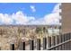 Balcony view of surrounding city offering beautiful views of the local trees and blue sky at 460 S Marion Pkwy # 1106, Denver, CO 80209