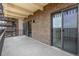 Open air balcony featuring brick siding and sliding glass doors for seamless indoor outdoor living at 460 S Marion Pkwy # 1106, Denver, CO 80209