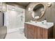 Modern bathroom features a frameless glass shower, white marble tile and contemporary vanity at 460 S Marion Pkwy # 1106, Denver, CO 80209