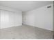 Minimalist bedroom offers neutral paint, soft carpet, and a spacious closet at 460 S Marion Pkwy # 1106, Denver, CO 80209