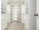 Walk-in closet features custom shelving and ample storage space at 460 S Marion Pkwy # 1106, Denver, CO 80209