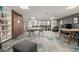 Bright community room with a wall of books and a walk-out to a courtyard at 460 S Marion Pkwy # 1106, Denver, CO 80209