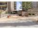 The Park Lane entrance featuring manicured landscaping and covered seating areas at 460 S Marion Pkwy # 1106, Denver, CO 80209