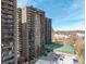 High-rise apartment buildings with balconies, parking and a tennis court at 460 S Marion Pkwy # 1106, Denver, CO 80209