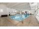 Indoor pool featuring tile flooring, lounge chairs and plenty of natural light at 460 S Marion Pkwy # 1106, Denver, CO 80209