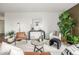 Chic living room with hardwood floors, stylish decor, and bright white walls providing a modern feel at 460 S Marion Pkwy # 1106, Denver, CO 80209
