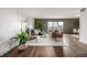 This sophisticated living area features hardwood floors, contemporary furniture, and a sliding glass door at 460 S Marion Pkwy # 1106, Denver, CO 80209