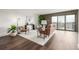 Bright living room with hardwood floors, stylish décor, balcony access through sliding glass door at 460 S Marion Pkwy # 1106, Denver, CO 80209