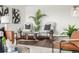 Modern living area with hardwood floors, contemporary chairs, and a stylish area rug at 460 S Marion Pkwy # 1106, Denver, CO 80209