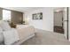 A serene main bedroom is brightened by lots of natural light at 460 S Marion Pkwy # 1106, Denver, CO 80209