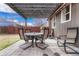 Cozy backyard patio under a pergola, ideal for relaxing or entertaining guests at 3640 York St, Denver, CO 80205