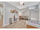 Bedroom with gray walls, carpeted floors, open concept bed-couch, and an easel in view at 3640 York St, Denver, CO 80205