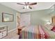 Bedroom with light green walls, carpeted floors, ceiling fan, and a closet in view at 3640 York St, Denver, CO 80205