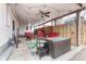 Inviting covered patio with comfortable seating, ceiling fan and decorative lighting at 3640 York St, Denver, CO 80205