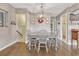 Cozy dining room featuring hardwood floors, decorative wreath, and modern light fixture at 3640 York St, Denver, CO 80205