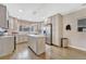 Modern kitchen with gray cabinets, stainless steel appliances, and a marble-topped island at 3640 York St, Denver, CO 80205