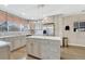 Modern kitchen with gray cabinets, stainless steel appliances, and a marble-topped island at 3640 York St, Denver, CO 80205