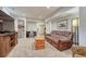 Relaxing living room with leather sofa, wooden chest, entertainment center, and soft carpet at 3640 York St, Denver, CO 80205