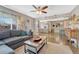 Inviting living room featuring hardwood floors and an open layout to the kitchen and dining area at 3640 York St, Denver, CO 80205