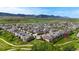 Aerial view of a neighborhood, showing lush landscaping and scenic mountain views in the background at 5932 Eldora St, Golden, CO 80403