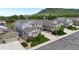 Aerial view of homes, showcasing manicured lawns, mature trees, and the neighborhood layout at 5932 Eldora St, Golden, CO 80403