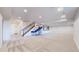 Spacious basement with carpet flooring, basketball hoop, and built-in media center at 5932 Eldora St, Golden, CO 80403