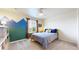 Cozy bedroom with a blue and green accent wall, creating a calming and inviting space at 5932 Eldora St, Golden, CO 80403