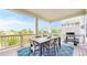 Covered deck offering an outdoor dining area, views of mountains, and a gas grill at 5932 Eldora St, Golden, CO 80403