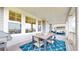 Spacious covered deck with dining and seating areas, perfect for outdoor entertainment at 5932 Eldora St, Golden, CO 80403
