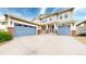 Stunning two-story home showcasing a three-car garage, brick accents, and inviting front porch at 5932 Eldora St, Golden, CO 80403