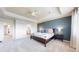 Spacious main bedroom featuring a tray ceiling and stylish décor, creating a tranquil and inviting atmosphere at 5932 Eldora St, Golden, CO 80403