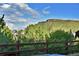 Scenic mountain view from the home, surrounded by mature trees and natural beauty at 5932 Eldora St, Golden, CO 80403