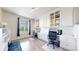 Bright office space with built-in desks and cabinets, perfect for remote work or study, with ample storage solutions at 5932 Eldora St, Golden, CO 80403