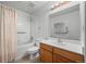 Clean bathroom with tub shower, tile, and light wood vanity at 31819 Rocky Village Dr # 301, Evergreen, CO 80439