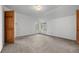 Bright bedroom with neutral carpet and white walls featuring large windows for natural light at 31819 Rocky Village Dr # 301, Evergreen, CO 80439