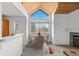 Open-concept dining area with modern table and chairs and view through large window at 31819 Rocky Village Dr # 301, Evergreen, CO 80439