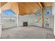 Open living space with vaulted wood ceilings, fireplace, and large windows offering picturesque views at 31819 Rocky Village Dr # 301, Evergreen, CO 80439
