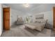 Spacious main bedroom with neutral décor, large windows, and adjacent closets at 31819 Rocky Village Dr # 301, Evergreen, CO 80439