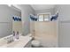 Bathroom featuring blue and white tile and a vanity at 1085 Victor St, Aurora, CO 80011