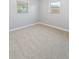 A sunlit empty bedroom with carpeted floors, gray walls, and white trim, awaiting personal touches to make it a home at 1085 Victor St, Aurora, CO 80011