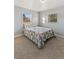 Light and airy bedroom with neutral walls, a quilt bed, and two windows, offering a serene space for rest at 1085 Victor St, Aurora, CO 80011
