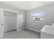Bedroom with a closet, light gray walls and carpet at 1085 Victor St, Aurora, CO 80011